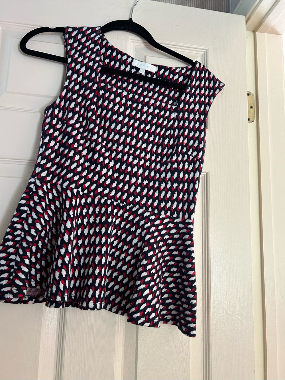 Perfect for July 4th. Sleeveless Knit Peplum Top in Navy with Red & White Print